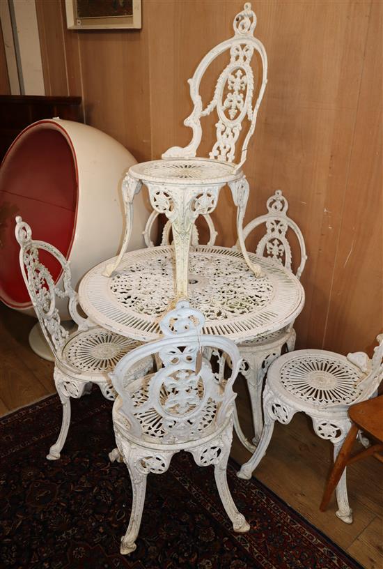A circular white painted aluninum garden table and six chairs Table 80cm diameter